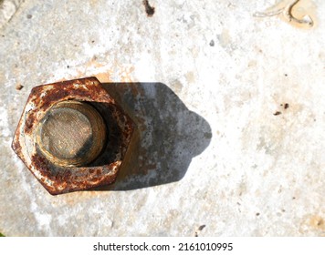 The Rusted Nut Is Fixed On The Gray Iron Plate. As The Base Of The Stadium Light Pole