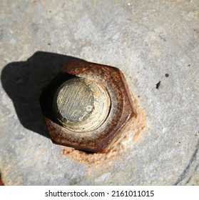 The Rusted Nut Is Fixed On The Gray Iron Plate. As The Base Of The Stadium Light Pole