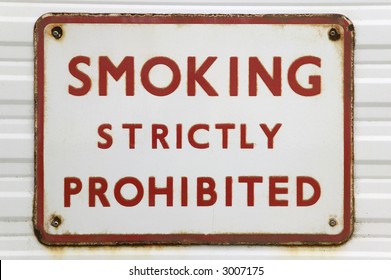 Rusted Old Sign With Text 'Smoking Strictly Prohibited'