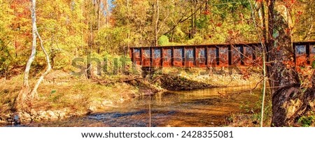 Rusted Railroad Bridge Over A Stream in Autumn, Montgomery County, Pennsylvania