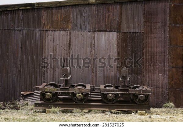 Rusted shed and train car\
parts