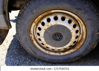 Rusted Steel Wheel On A VW Transporter Van With Black Centre Hubcap, North Wales, UK, 24th April 2020. 