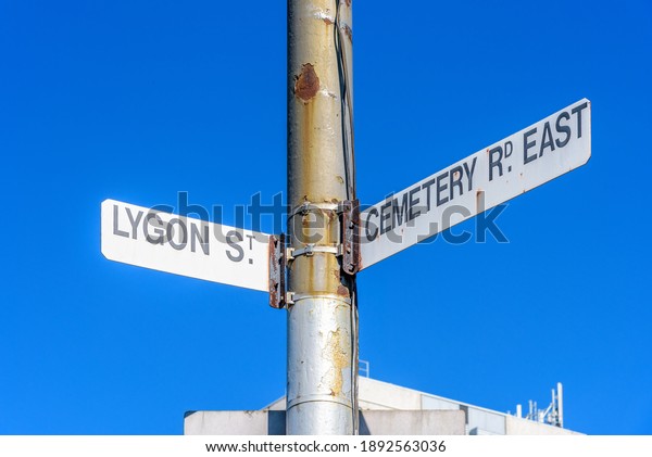 A rusted street sign
in Melbourne, Australia on the crossroads of Lygon Street and
Cemetery Road East