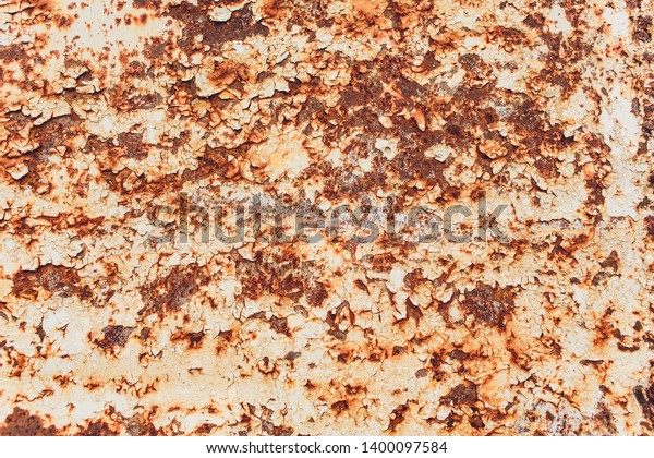 Rusted white painted metal wall.
Rusty metal background with streaks of rust. Rust stains. The metal
surface rusted spots.metal rust texture
background.