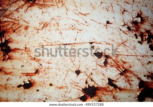 Rusted white painted metal wall. Rusty\
metal background with streaks of rust. Rust stains. The metal\
surface rusted spots.metal rust texture\
background