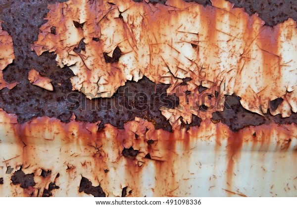 Rusted white painted metal wall.\
Rusty metal background with streaks of rust. Rust stains. The metal\
surface rusted spots.metal rust texture\
background.