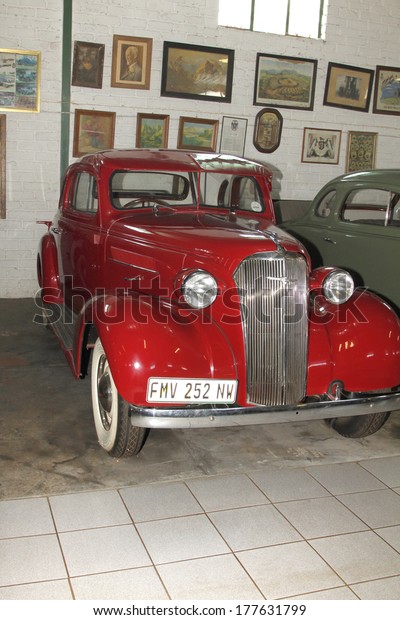 RUSTENBURG, SOUTH AFRICA -\
FEBRUARY 15:  Red 1937 Chevrolet Coupe Front View in Private\
Collection Philip Classic Cars on February 15, 2014 in Rustenburg\
South Africa.   