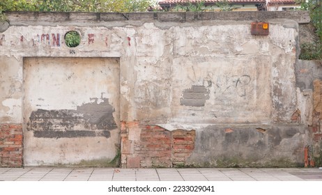 Rustic abandoned facade in sidewalk
