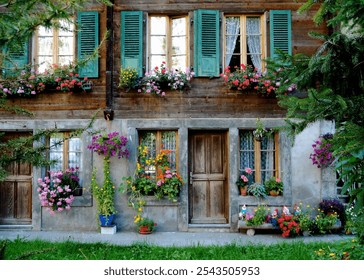 Rustic Alpine Chalet with Flowering Window Boxes - A charming wooden chalet in the picturesque Swiss Alps village of Lauterbrunnen.