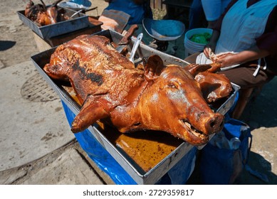 rustic and authentic presentation of Cuchi Canca (Huaraz-style Roasted Pork), a traditional culinary treasure from the Ancash region of the Peruvian Andes. This dish is a centerpiece of local festivities and Sunday markets in the Callejón de Huaylas.