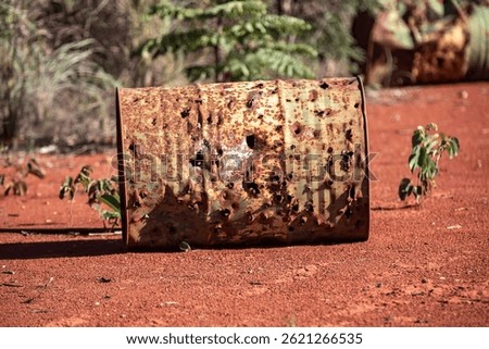Rustic background with brass drums pierced by gunshots