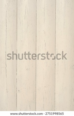 Rustic background featuring weathered vertical wooden planks painted in a distressed off white or light cream color with visible texture and grain