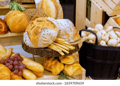 Rustic bakery showcases an array of freshly baked bread, pastries, seasonal fruits under warm light.