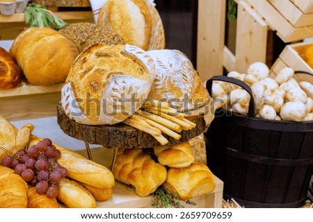 Rustic bakery showcases an array of freshly baked bread, pastries, seasonal fruits under warm light.