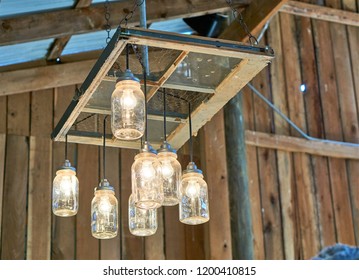     Rustic barn lighting made with mason jars.                           