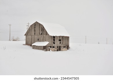 Rustic barn with snow background