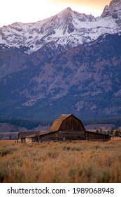 Rustic Barn With Snow Covered Mountains 