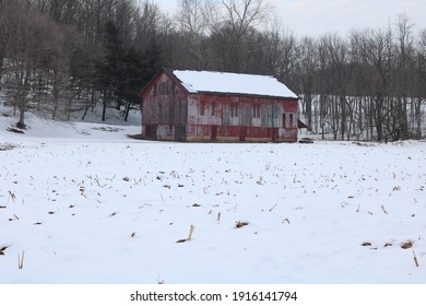 Rustic Barn With Snow In Foreground