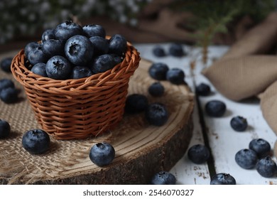 A rustic basket filled with fresh blueberries sits on a wooden surface. Ideal for promoting healthy eating, summer recipes, and organic produce. - Powered by Shutterstock