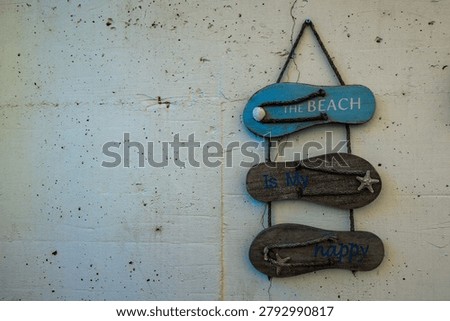 Rustic Beach Direction Sign Hanging on White Wall with Coastal Decor