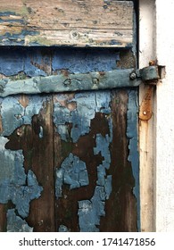 Rustic Beautiful Blue Paint Chipped On Old Door Closeup Detail