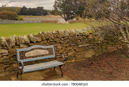 Rustic Bench Beside Dry Stone Wall In  Tasmania Australia. Peaceful, Restful Contemplative, Old World Charm