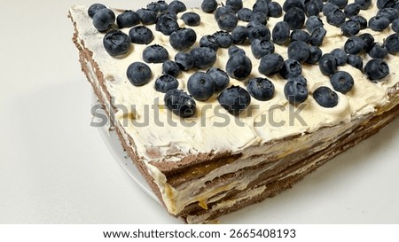 Rustic blueberry layer cake, sumptuous winter solstice treat, enticing aroma of vanilla cream, celebrating Hygge and Lammas