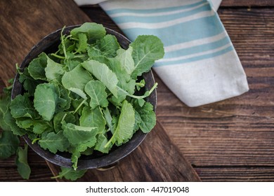 Rustic Bowl With Fresh Baby Kale Leaves, Overhead View