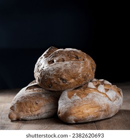 Rustic bread loaf on Black Slate Board. - Powered by Shutterstock