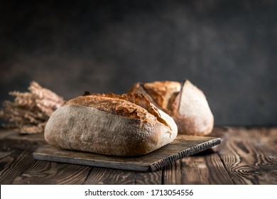 Rustic bread on a rustic background with copy space. - Powered by Shutterstock