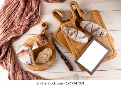 Rustic bread on old vintage planked wood table with free text space.