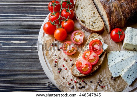 Similar – Image, Stock Photo Bruschetta with cream cheese, cherry tomatoes and basil