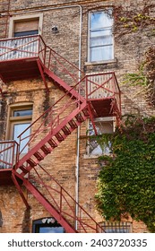 Rustic Brick Building with Fire Escape and Ivy, Urban Geometry Perspective