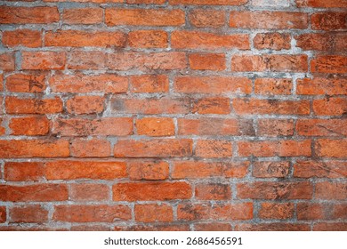 Rustic brick wall background tetxture in different shades of red and orange. Old red brick wall background texture close up. Background for designs or 3d texture.