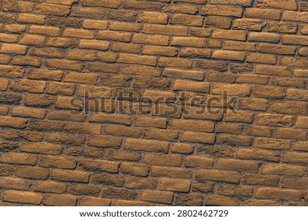 Rustic brick wall showcasing natural stone bricks, warm earth tones, traditional running bond pattern, weathered mortar lines, texture and grain details, aged appearance, golden hour lighting, sturd.