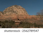 Rustic cabin on slopes of Red rock cliffs in West Sedona, Arizona