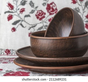 Rustic Ceramic Tableware On An Embroidered Tablecloth. 