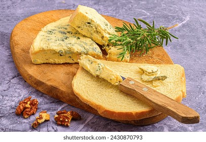 Rustic Charm: Blue Cheese with Bread, Walnuts, and Rosemary on Marble - Powered by Shutterstock