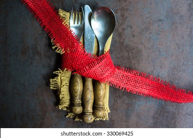 Rustic christmas table setting with bright plates and silverware
