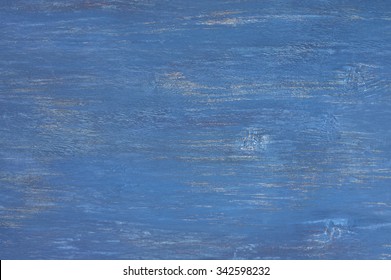 Rustic dark blue painted wood texture as background.
