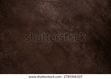 Rustic dark brown textured wall with distressed painterly pattern and rich grunge details, dramatic background for design use
