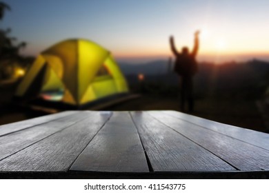 Rustic dark desk space and night camping in forest background. - Shutterstock ID 411543775