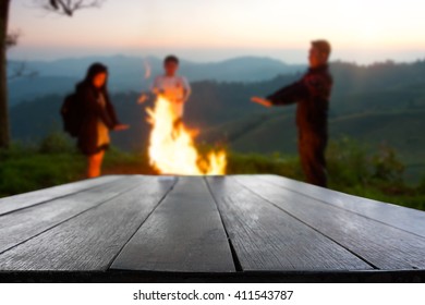Rustic dark desk space and night camping in forest background. - Shutterstock ID 411543787