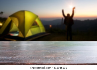 Rustic dark desk space and night camping in forest background. - Shutterstock ID 415946131