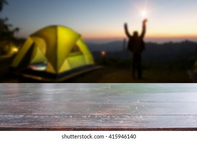 Rustic dark desk space and night camping in forest background. - Shutterstock ID 415946140