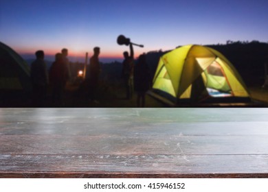 Rustic dark desk space and night camping in forest background. - Shutterstock ID 415946152