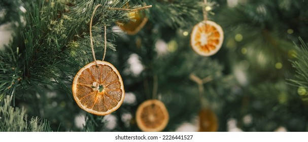 Rustic decorated ornament on Christmas tree with dried orange slices, sustainable Christmas decors concept - Powered by Shutterstock