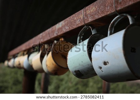 Rustic decorations.  Rusted enamel cups