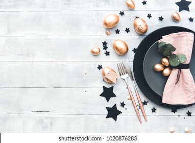 Rustic Easter Table Setting With Gold Eggs. Top View 