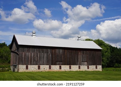 Rustic Farmhouse Sits On Countryside 